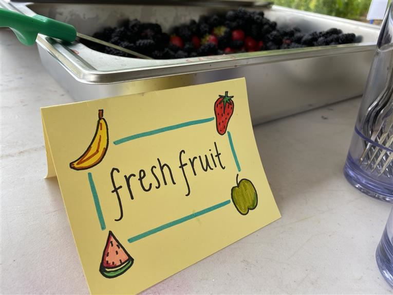 Fresh berries and pretty signage that says Fresh Fruit